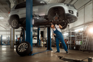mechanic busy in car exhaust repair
