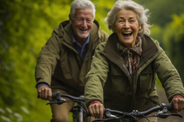 An old couple cycling and happy doing other outdoor activities for physical wellbeing