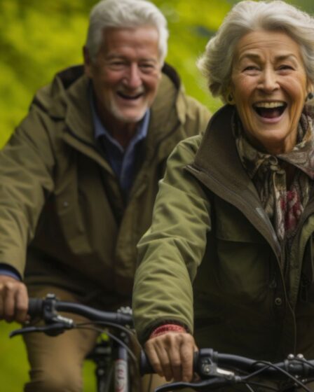 An old couple cycling and happy doing other outdoor activities for physical wellbeing