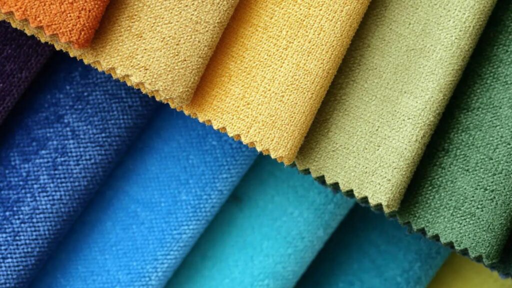 Colorful fabric swatches showcasing a vibrant array of hues and patterns, perfect for textile entrepreneurs
